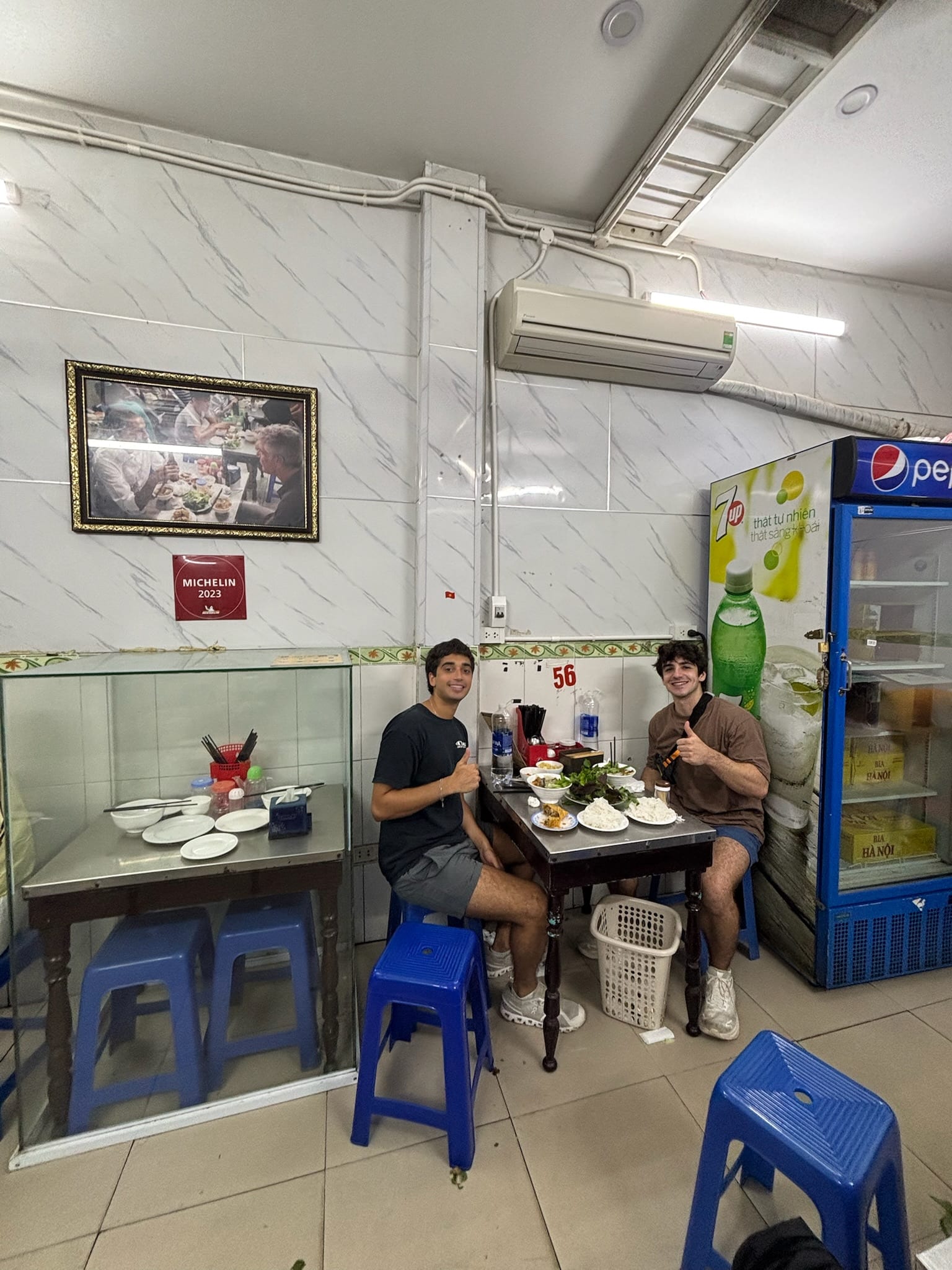Sharing a meal with a friend at a restaurant in Hanoi